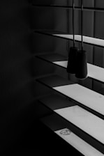 Modern roller blinds in a bright, minimalist living room.