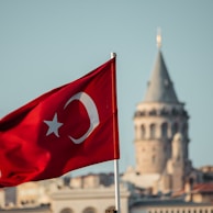 a turkey flag flying in front of a city