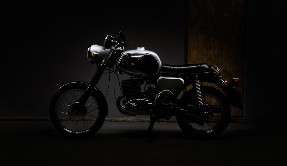 a motorcycle is parked in a dark room