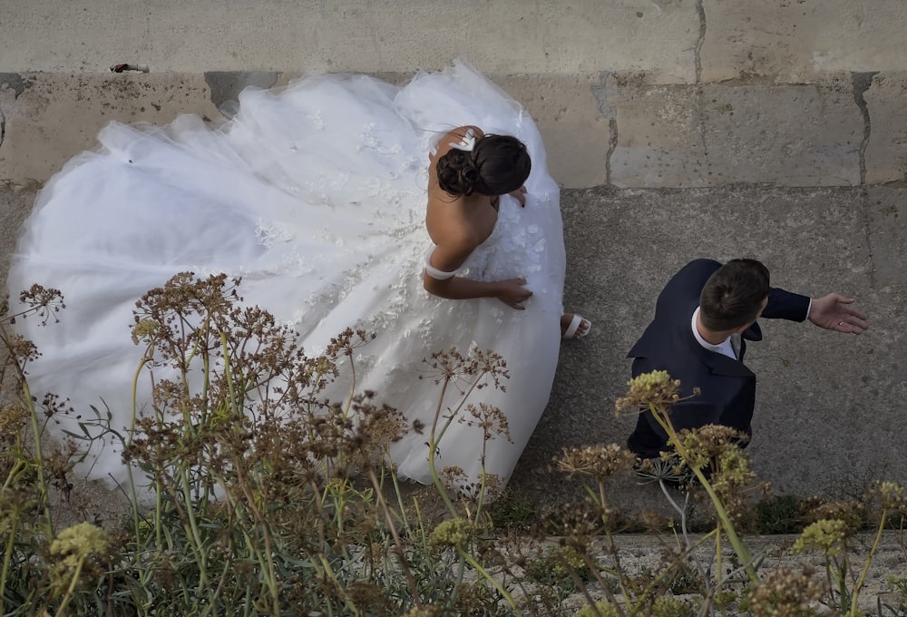 a bride and groom standing next to each other