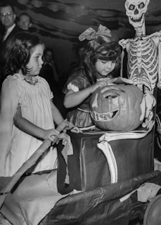 Children enjoying games at a Halloween party.