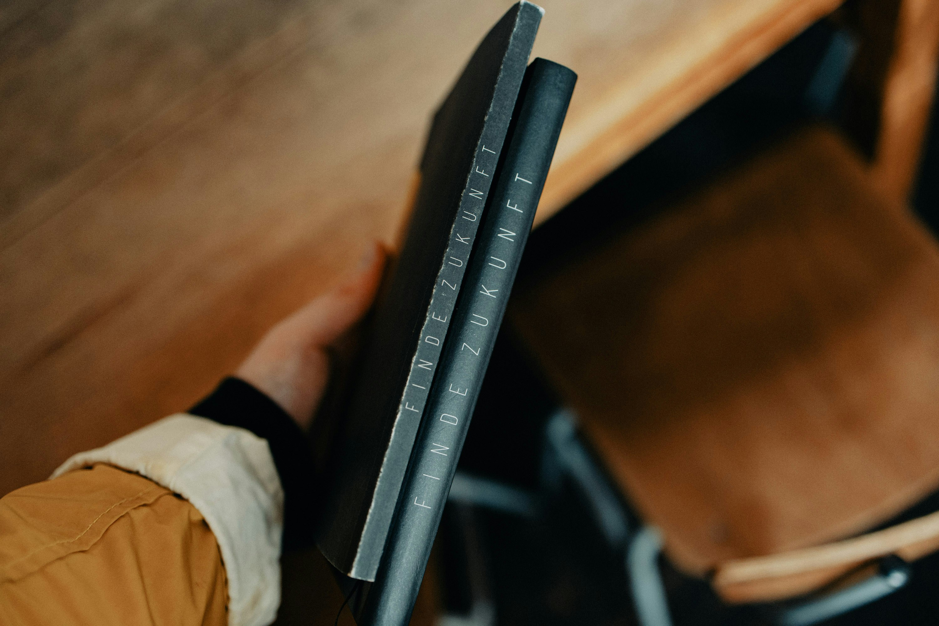 a person holding a book in their hand