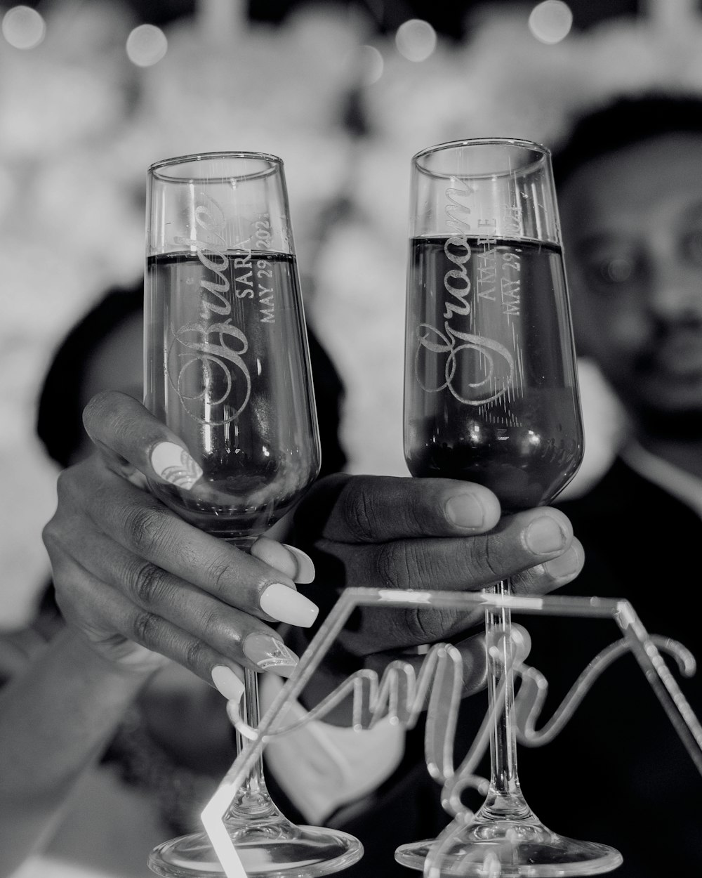 a couple of people holding up wine glasses