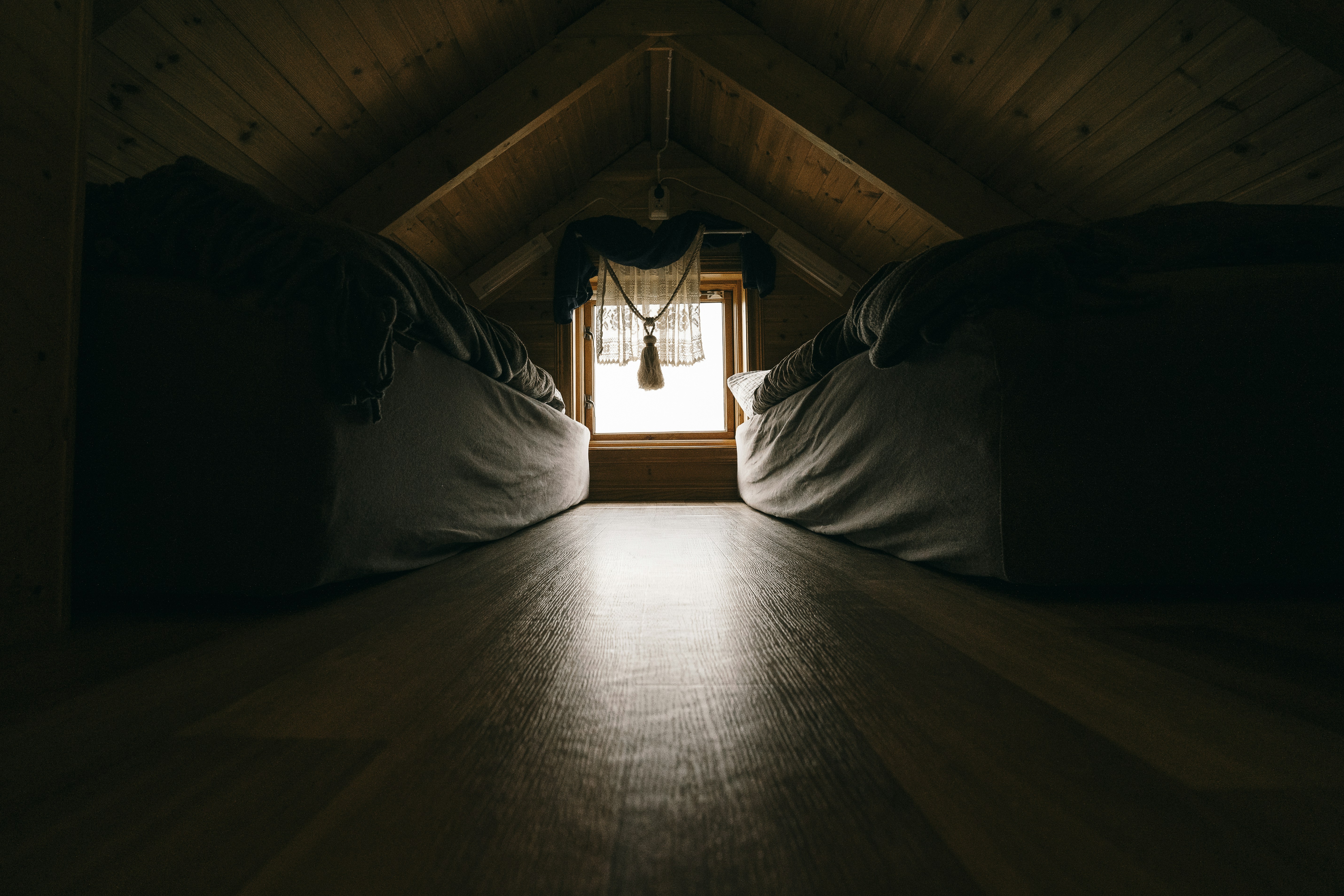 a room that has some beds in it