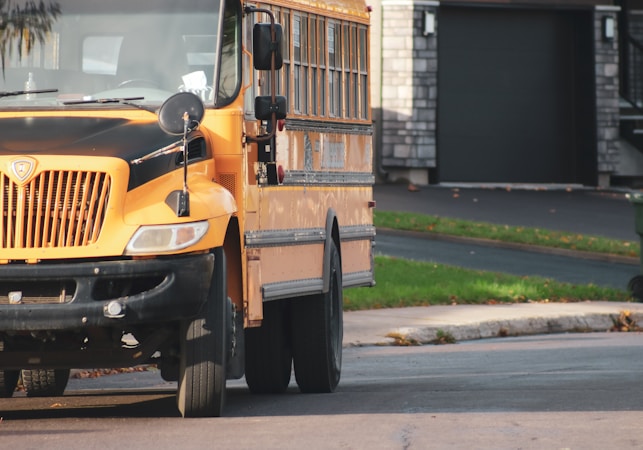 A yellow school bus on a residential street, part of the daily routine CCSD police help keep safe