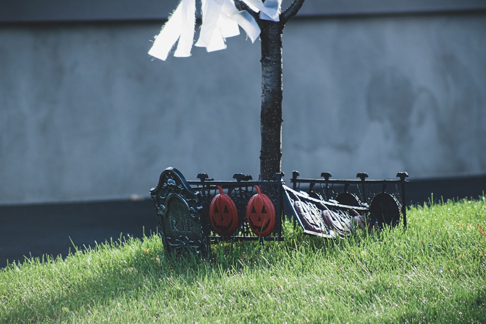 a tree with a bunch of red and black wheels attached to it