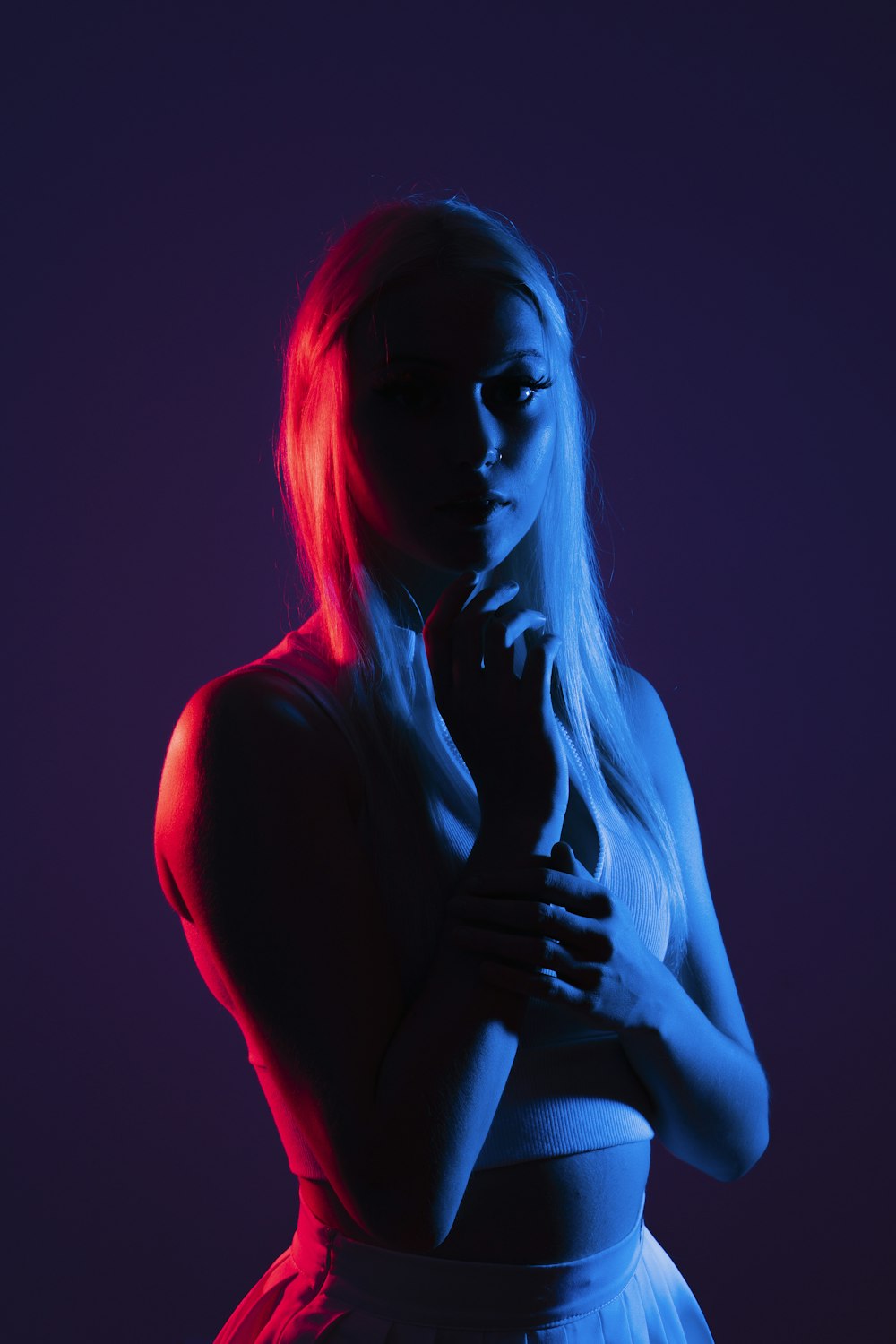 a person wearing a blue light in a dark room