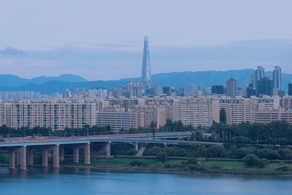 a large body of water with a city in the background