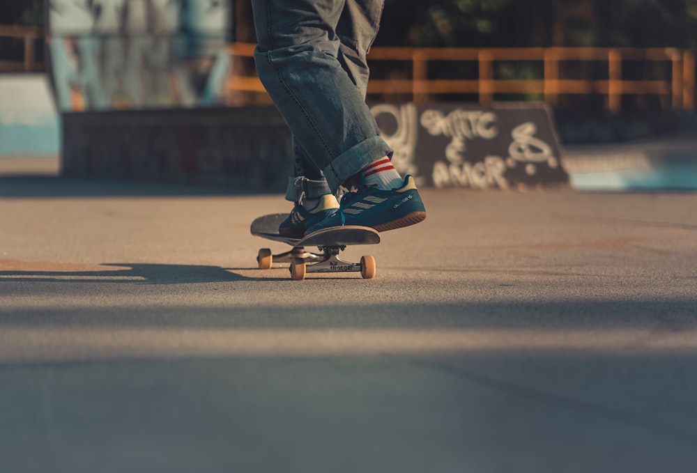 a man riding a skateboard down a street