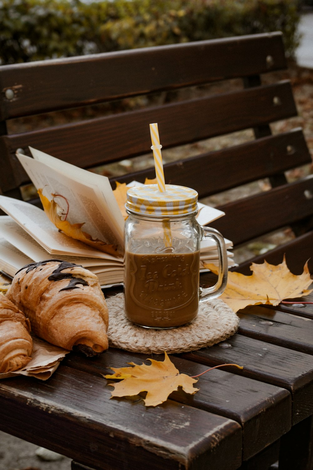 a jar of coffee sitting on top of a wooden table