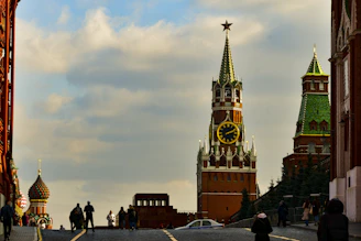 A majestic view of the Red Square in Moscow, bathed in golden sunset light.