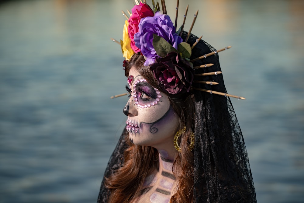 a woman with makeup and flowers on her head