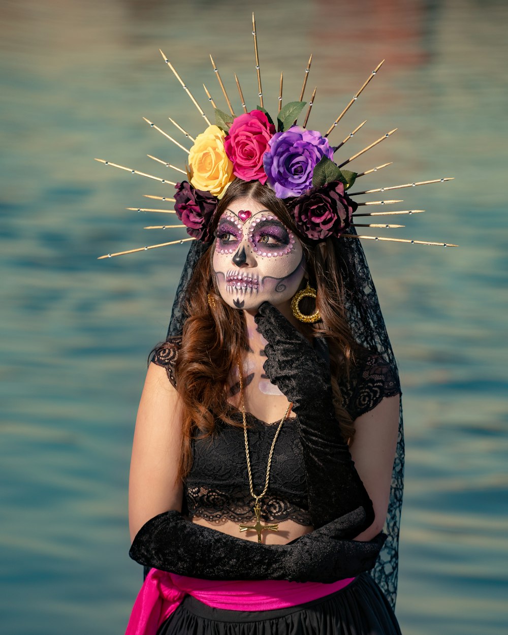 a woman with makeup and flowers on her head