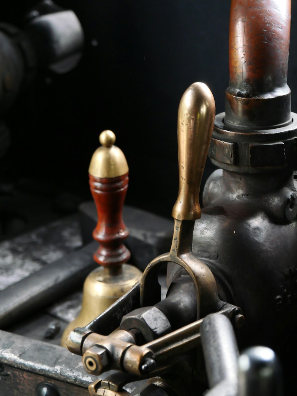 a close up of a metal object with a wooden handle