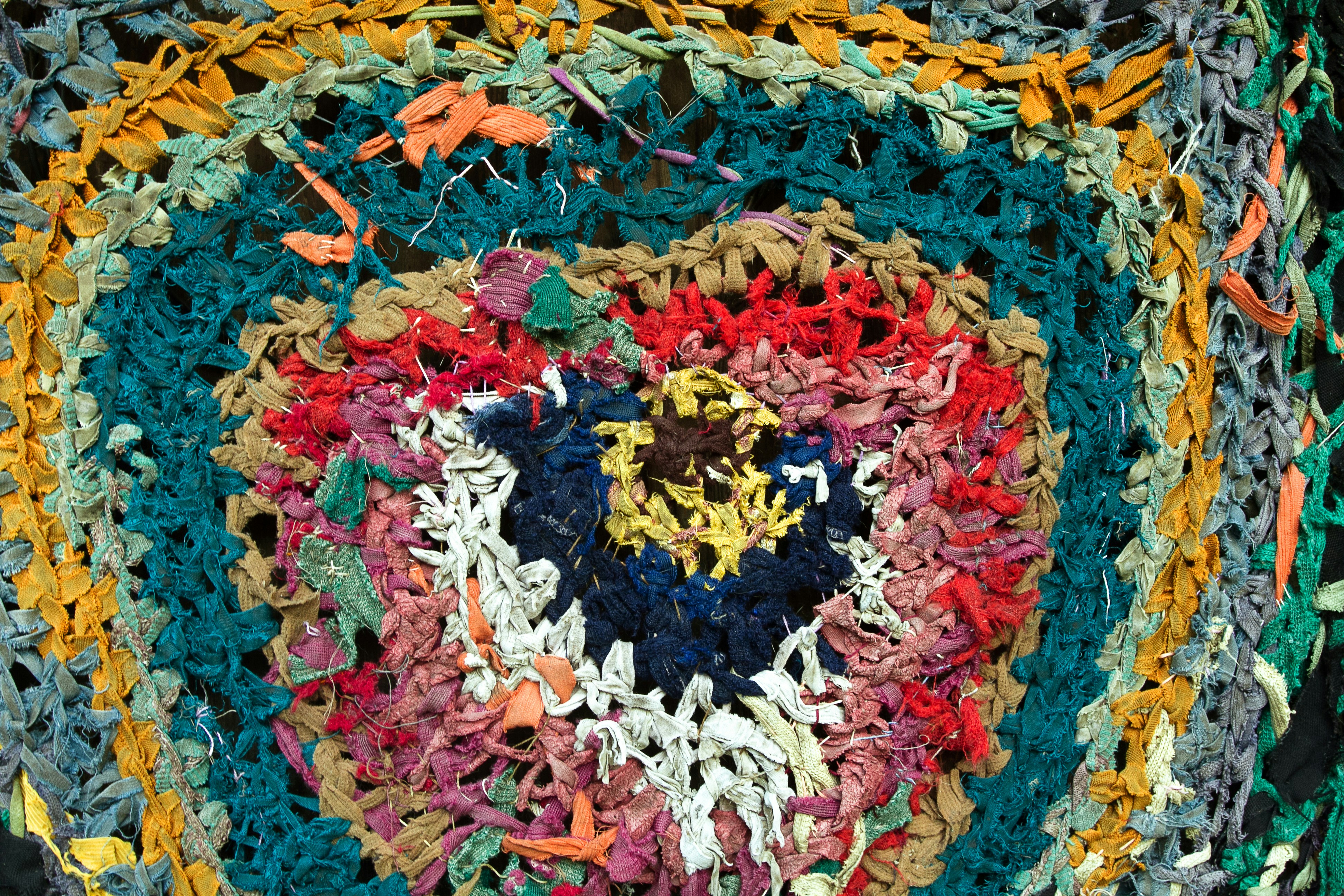 Colorful round handmade floor carpet mat made of ribbons and rags