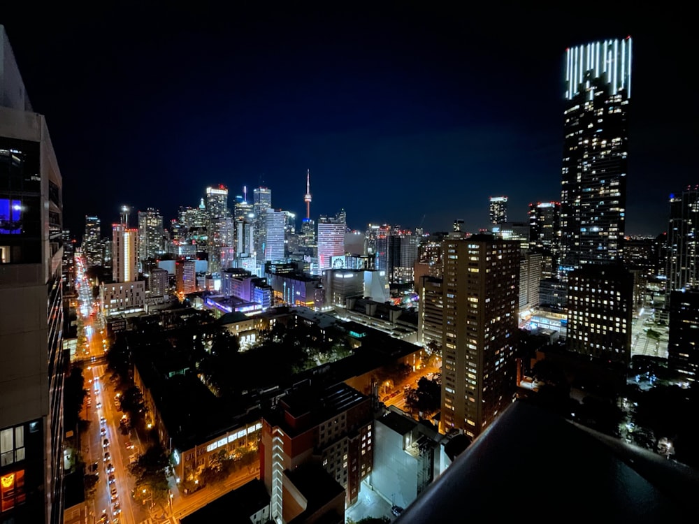 a view of a city at night from the top of a building