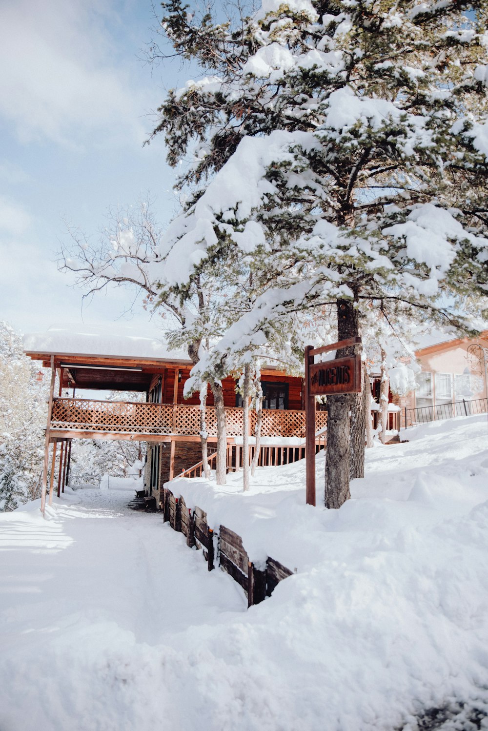 a house in the woods covered in snow