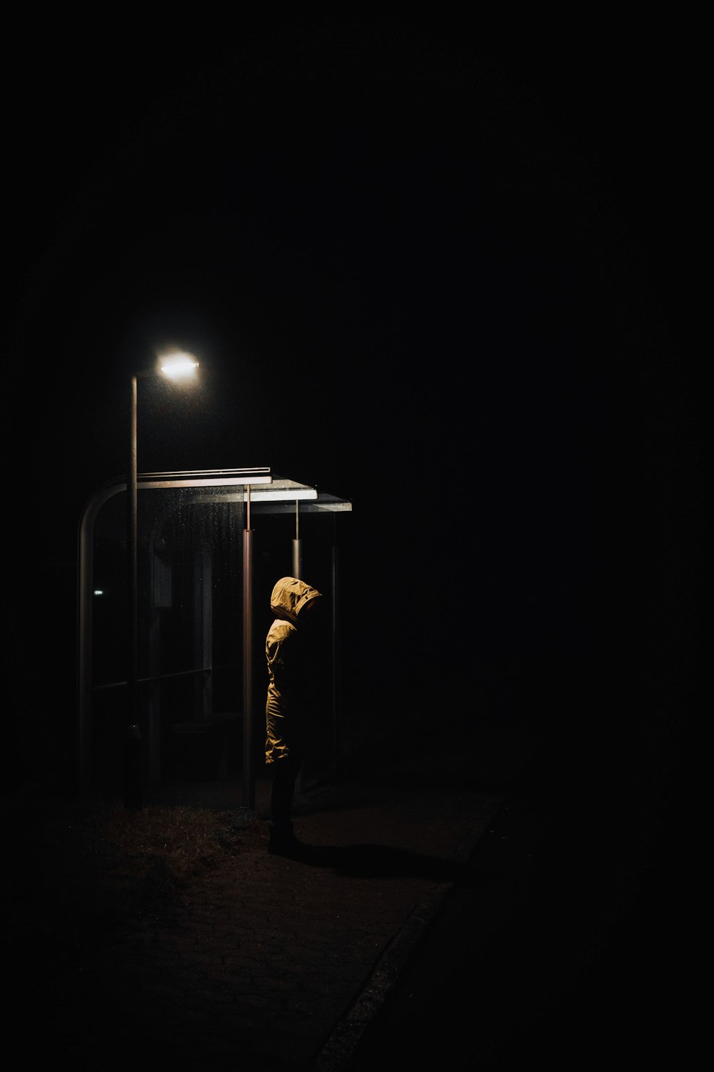 a person standing in the dark at night