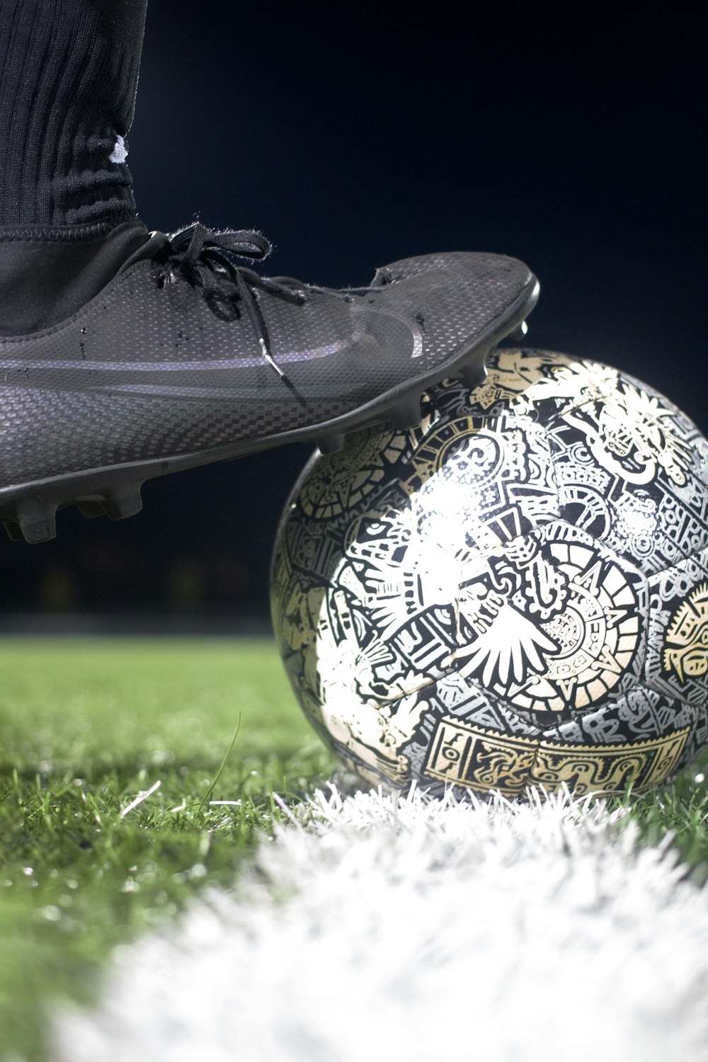 a close up of a soccer ball on a field