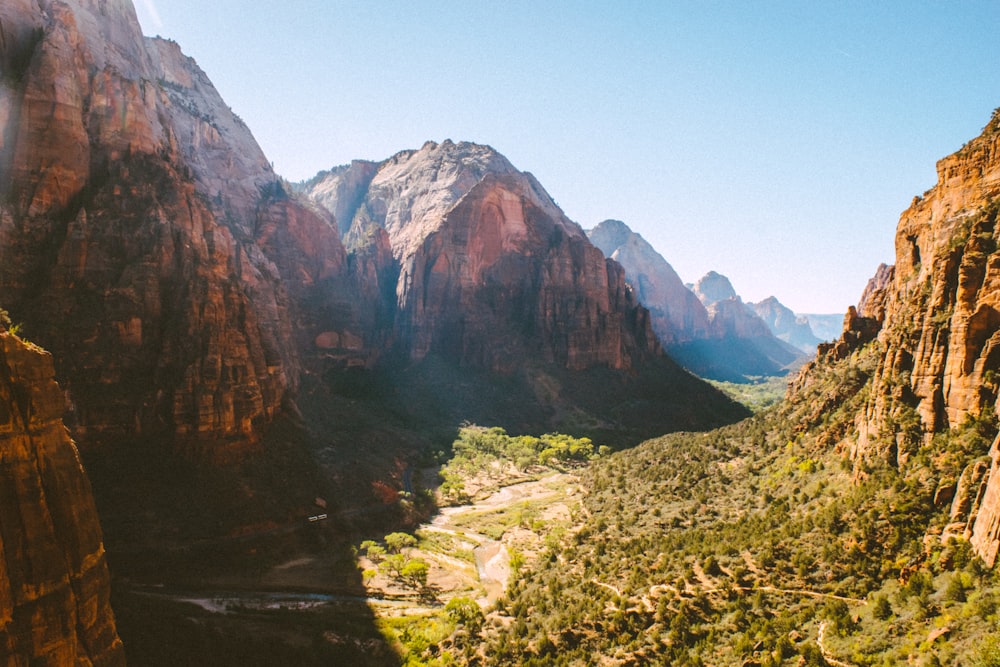 a view of a valley with mountains in the background