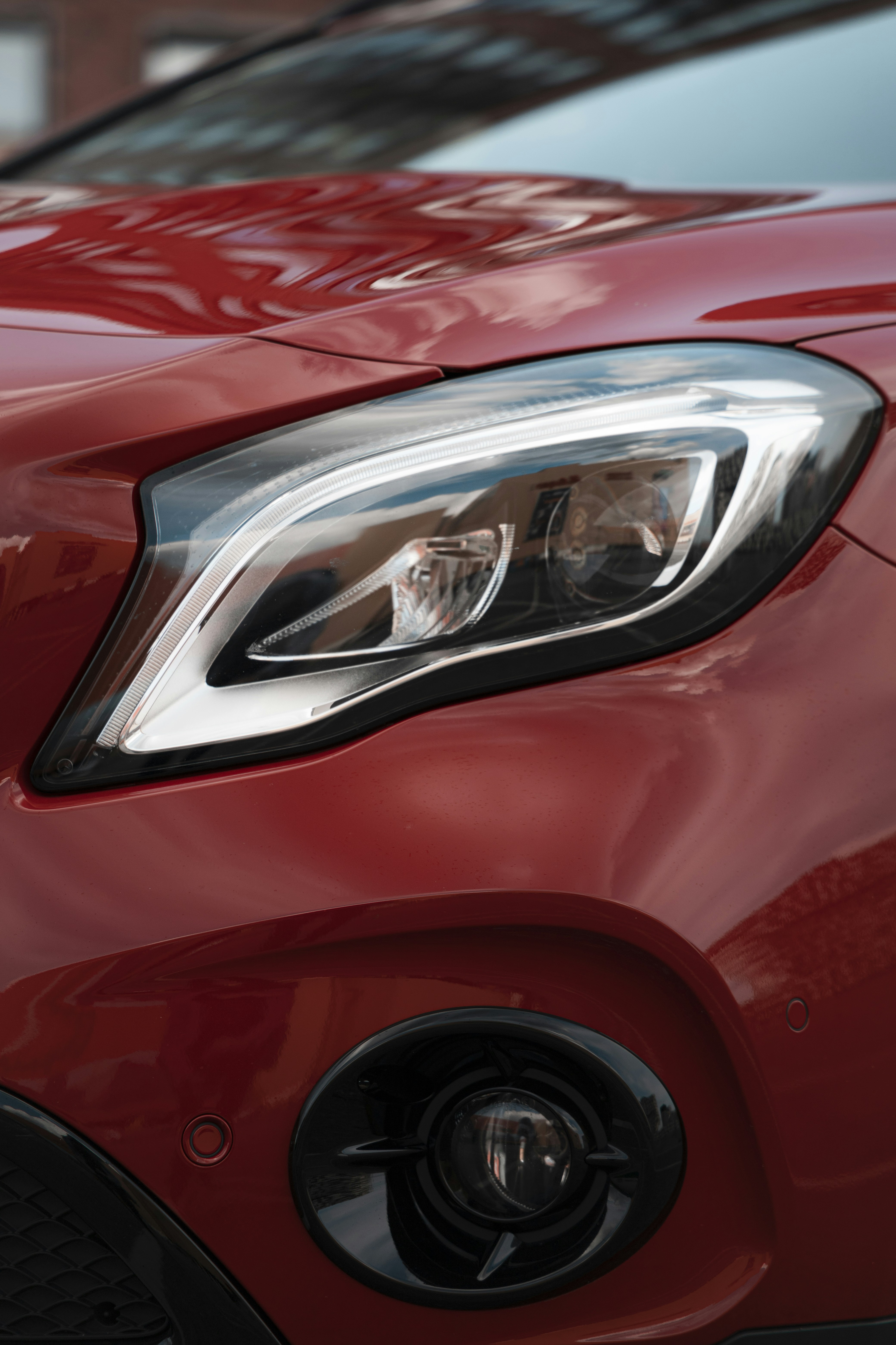 a close up of the front of a red car