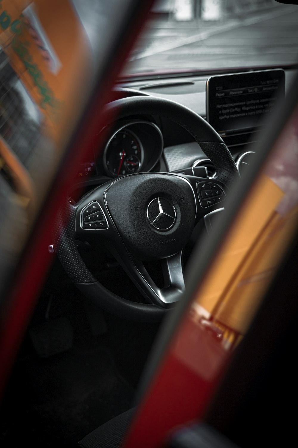 the interior of a car with a steering wheel and dashboard