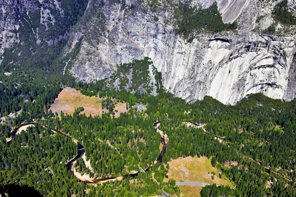 an aerial view of a mountain with a river running through it