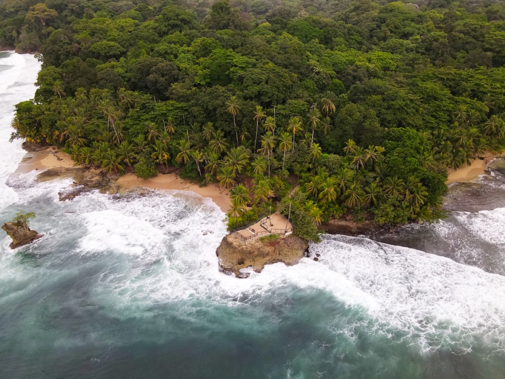 an aerial view of a tropical island in the ocean