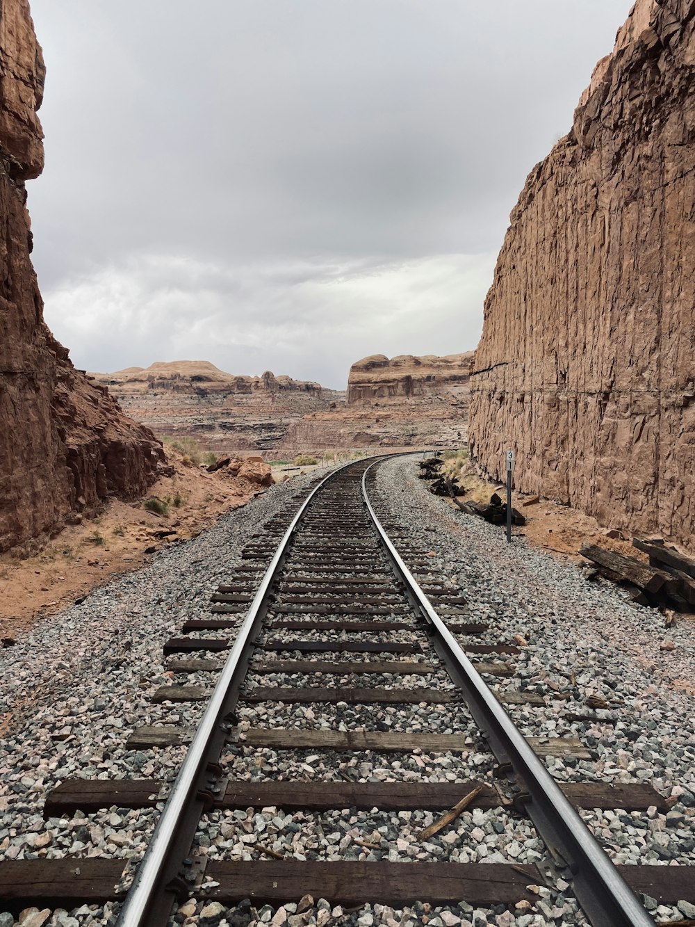 a train track in the middle of a desert