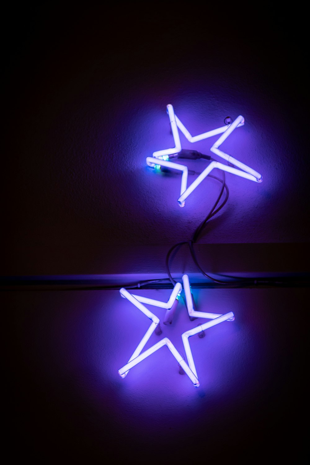 a pair of neon lights sitting on top of a table