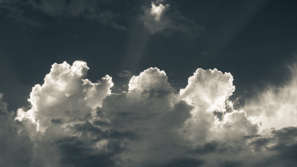 a black and white photo of clouds in the sky