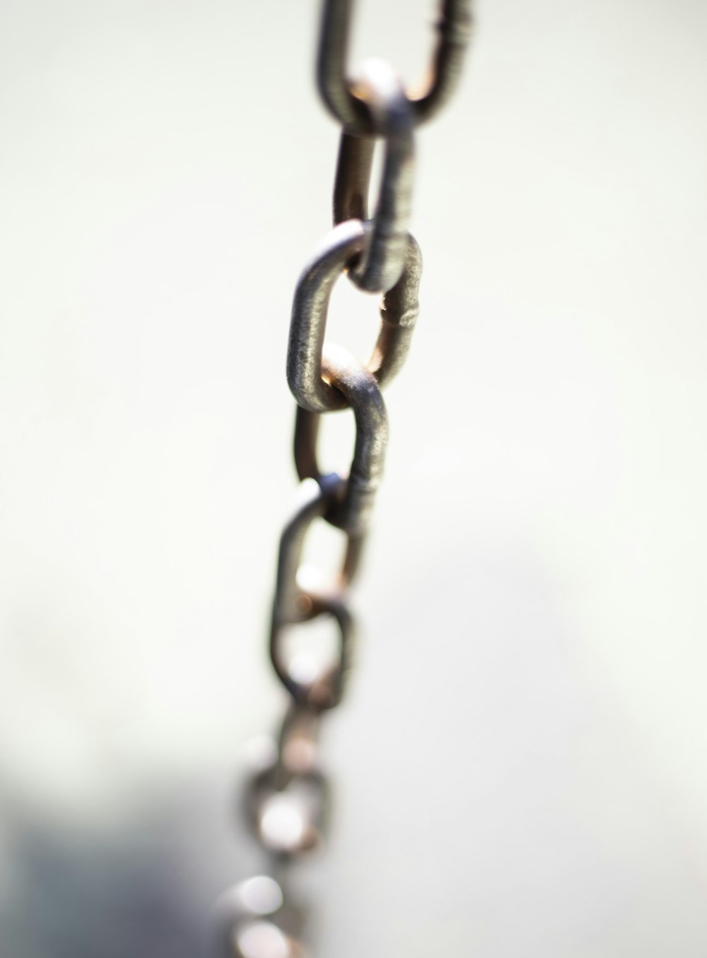 a close up of a metal chain on a table