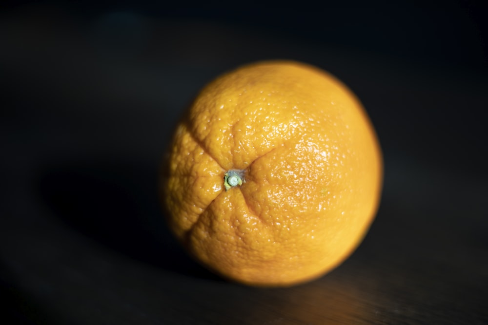 a close up of an orange on a table