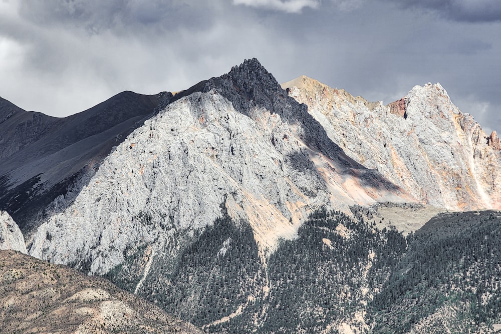 a view of a mountain range with a cloudy sky