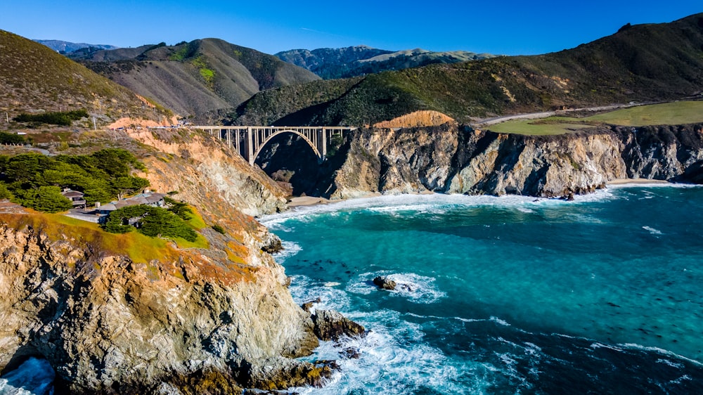 an aerial view of a bridge over a body of water