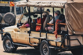 a group of people riding in the back of a truck