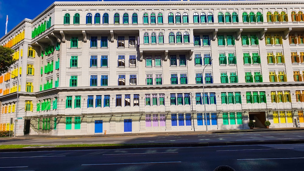 a multicolored building on the corner of a street