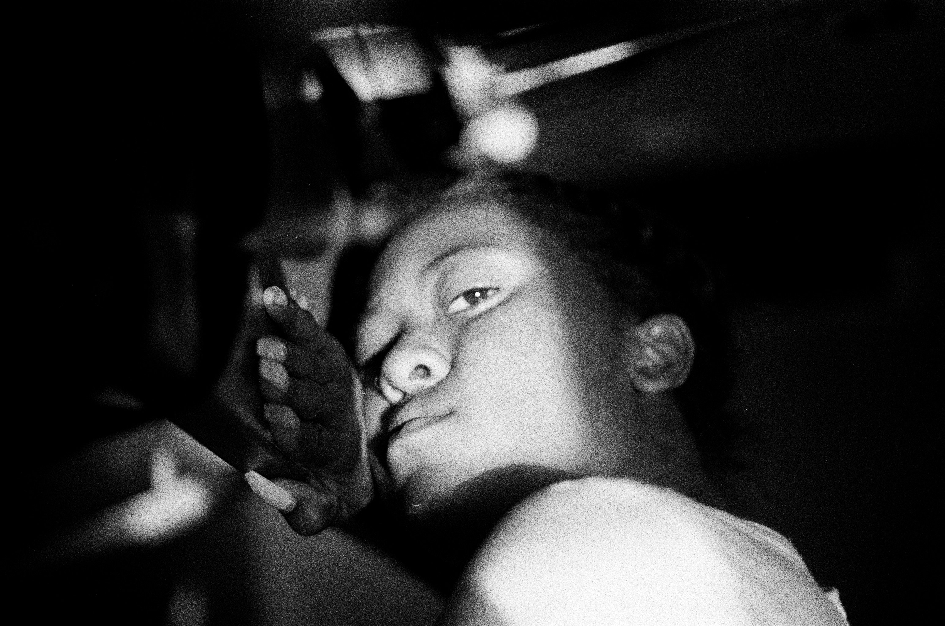 a woman holding a cell phone to her ear, 