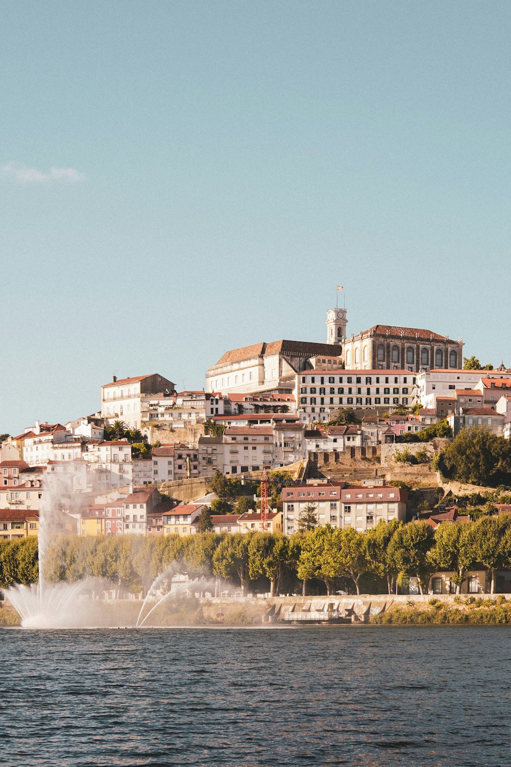 a jet skis across a body of water in front of a city