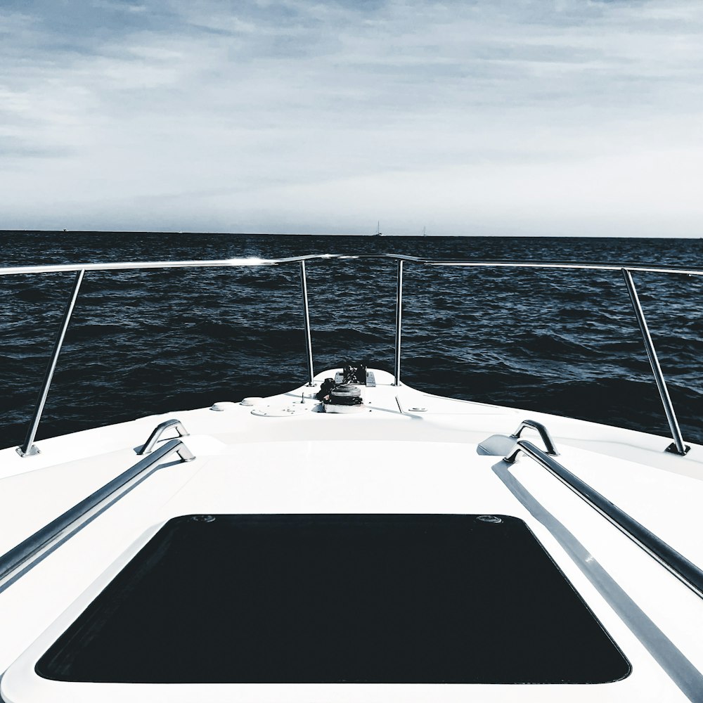 a white boat in the middle of the ocean