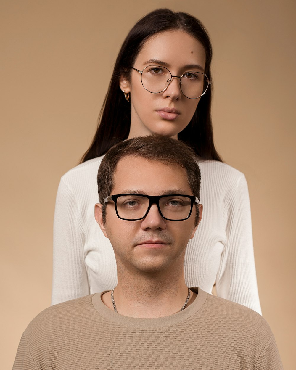 a man and a woman with glasses on their heads