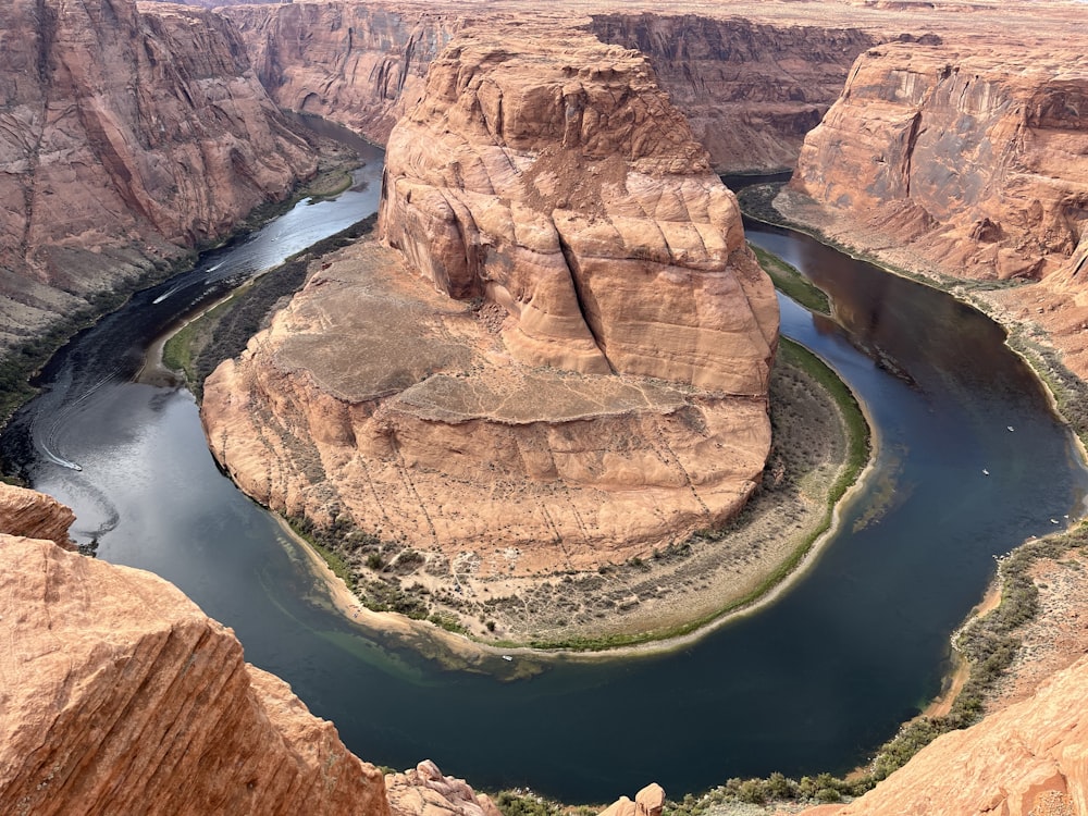 a river running through a canyon surrounded by mountains