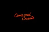 a neon sign that reads come and create