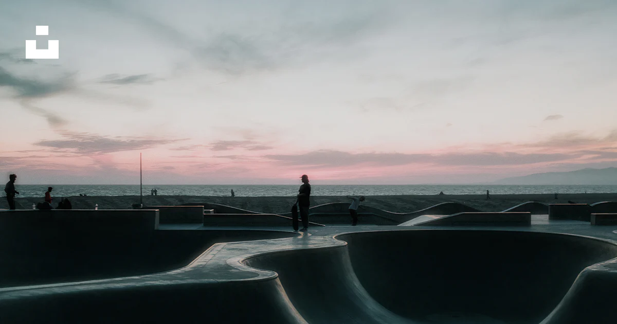 Unsplash Ramps A person standing on top of a skateboard ramp photo – Free Venice beach ...