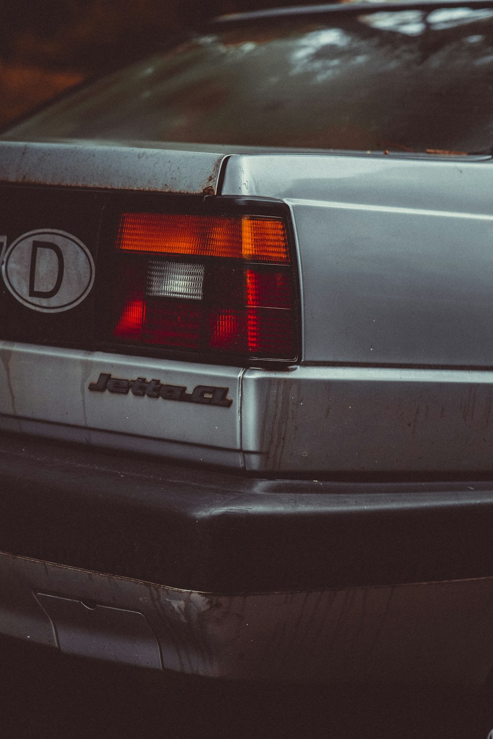 the back end of a silver sports car