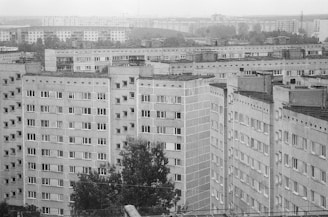 a black and white photo of a city with tall buildings