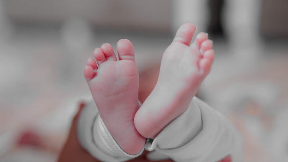 a close up of a baby's bare feet