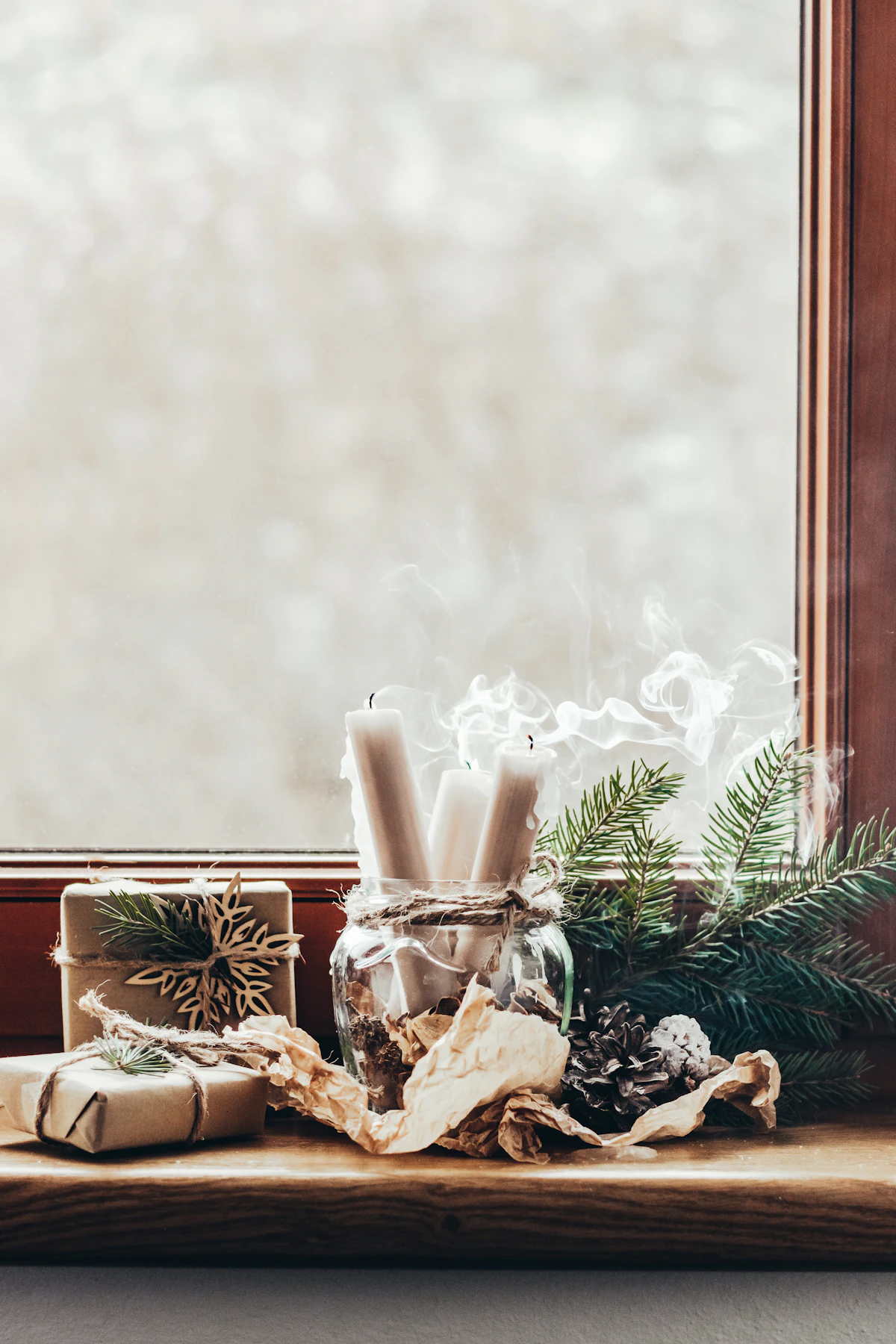 A handmade candle styled with dried flowers