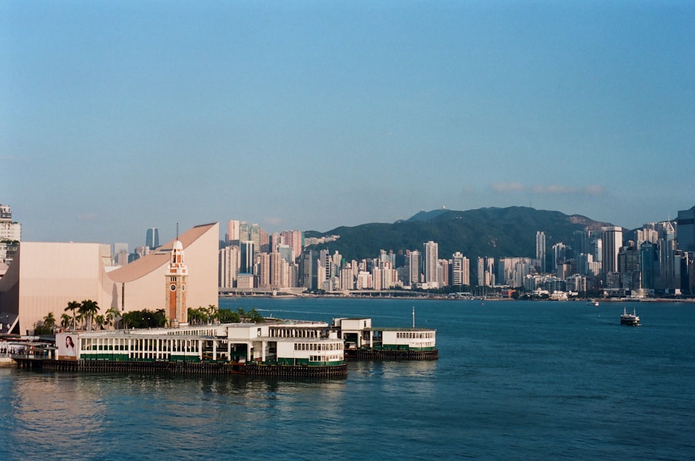 a large body of water with a city in the background