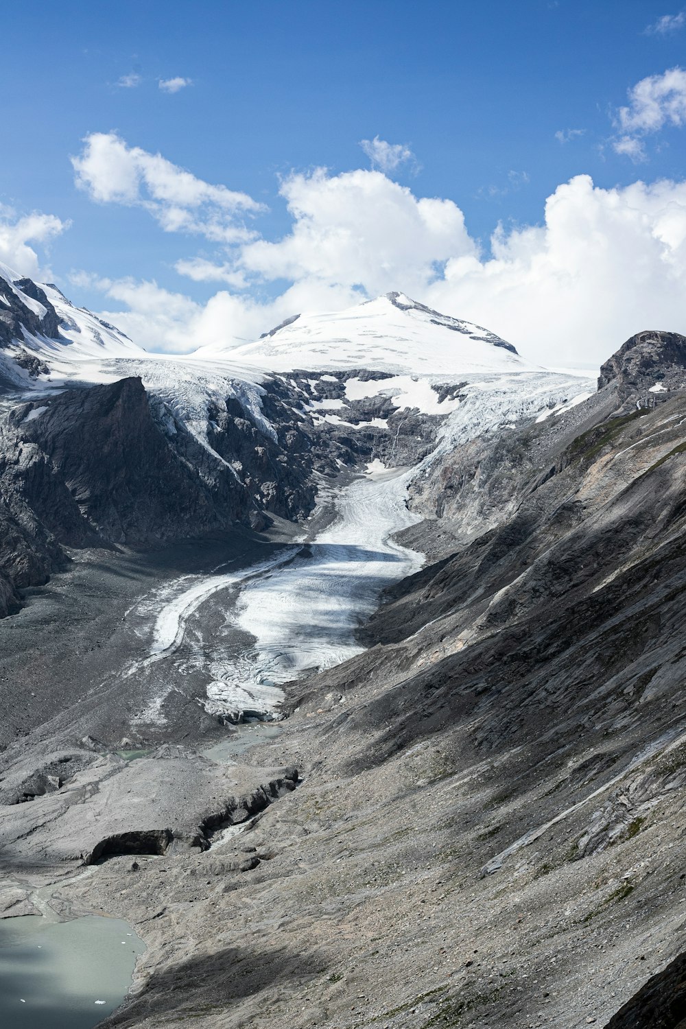 a mountain range with a lake in the middle of it